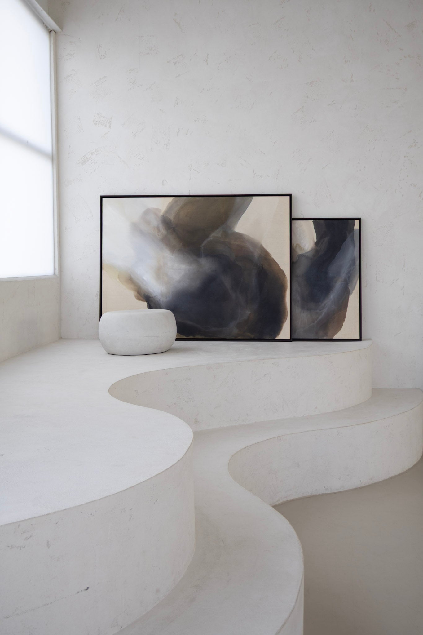 Abstract paintings “Becoming” and “Light Between” from the Before the Light Touches series, large canvases in earthy tones, shown side by side in modern interior.
