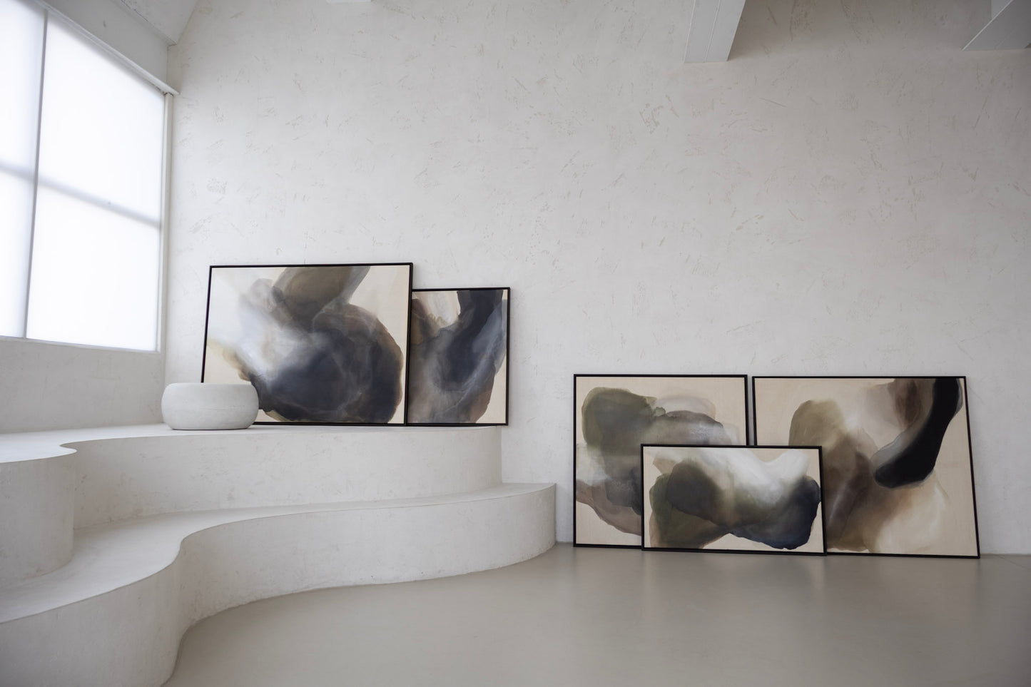 Abstract paintings “Becoming” and “Light Between” from the Before the Light Touches series, large canvases in earthy tones, shown side by side in modern interior.